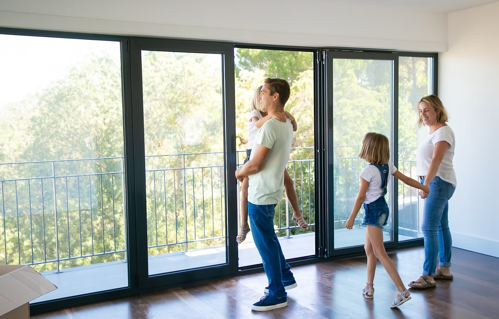 Family enjoying a bright home fitted with black aluminium windows and doors